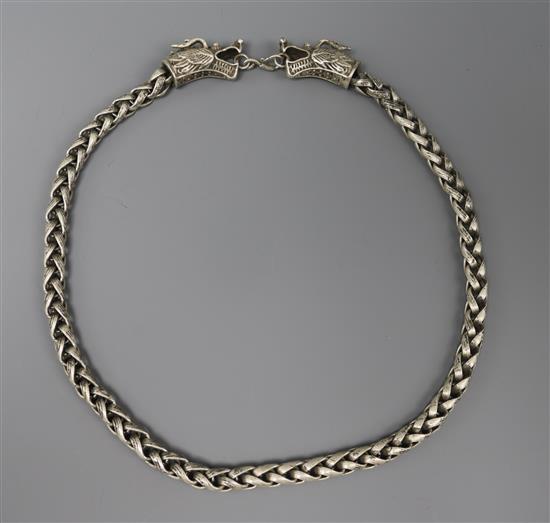 A Chinese white metal dragon head chain